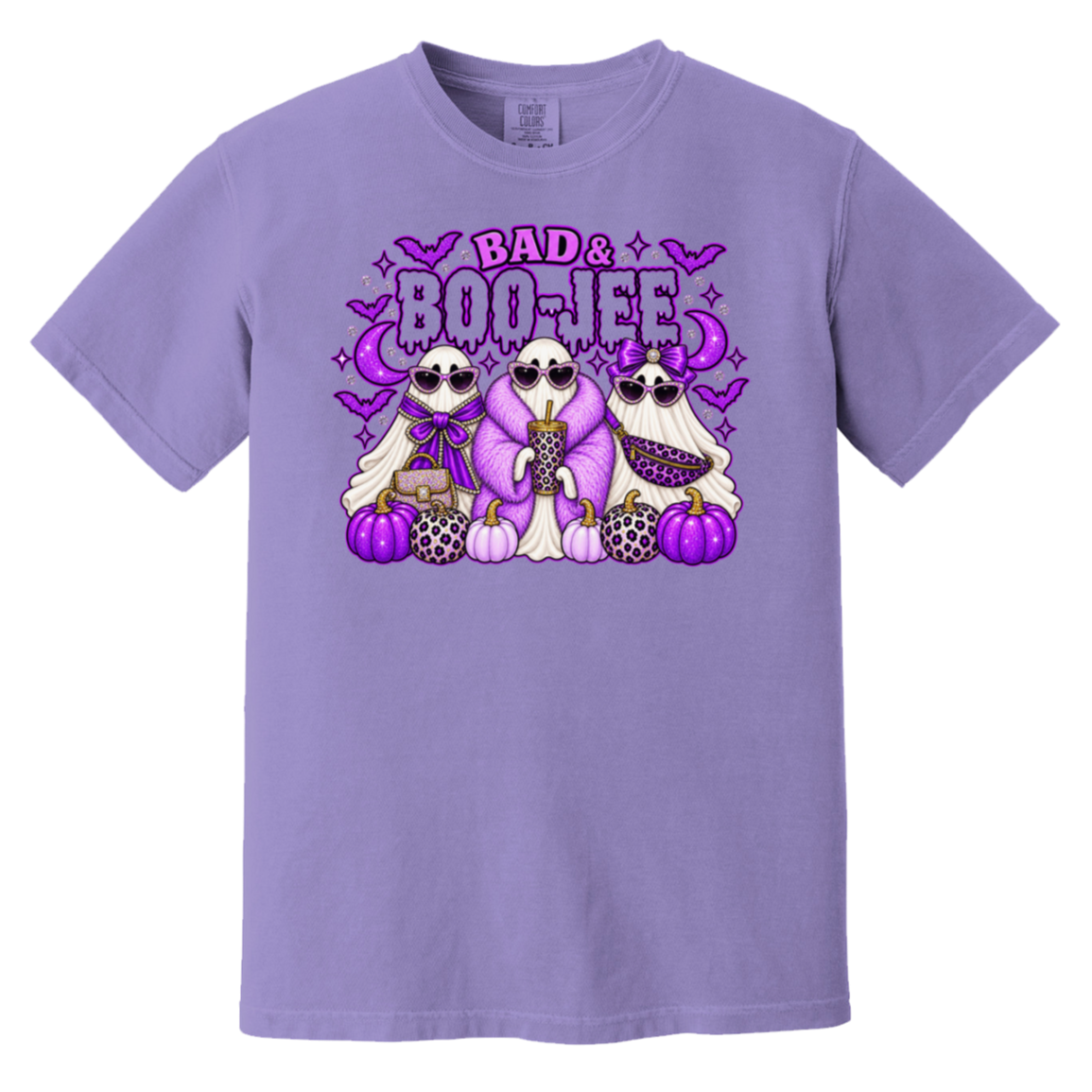 A lavender purple short-sleeve crewneck t-shirt featuring a colorful graphic print of three cartoon ghosts and purple pumpkins, under the text 'BAD & BOO-JEE'.