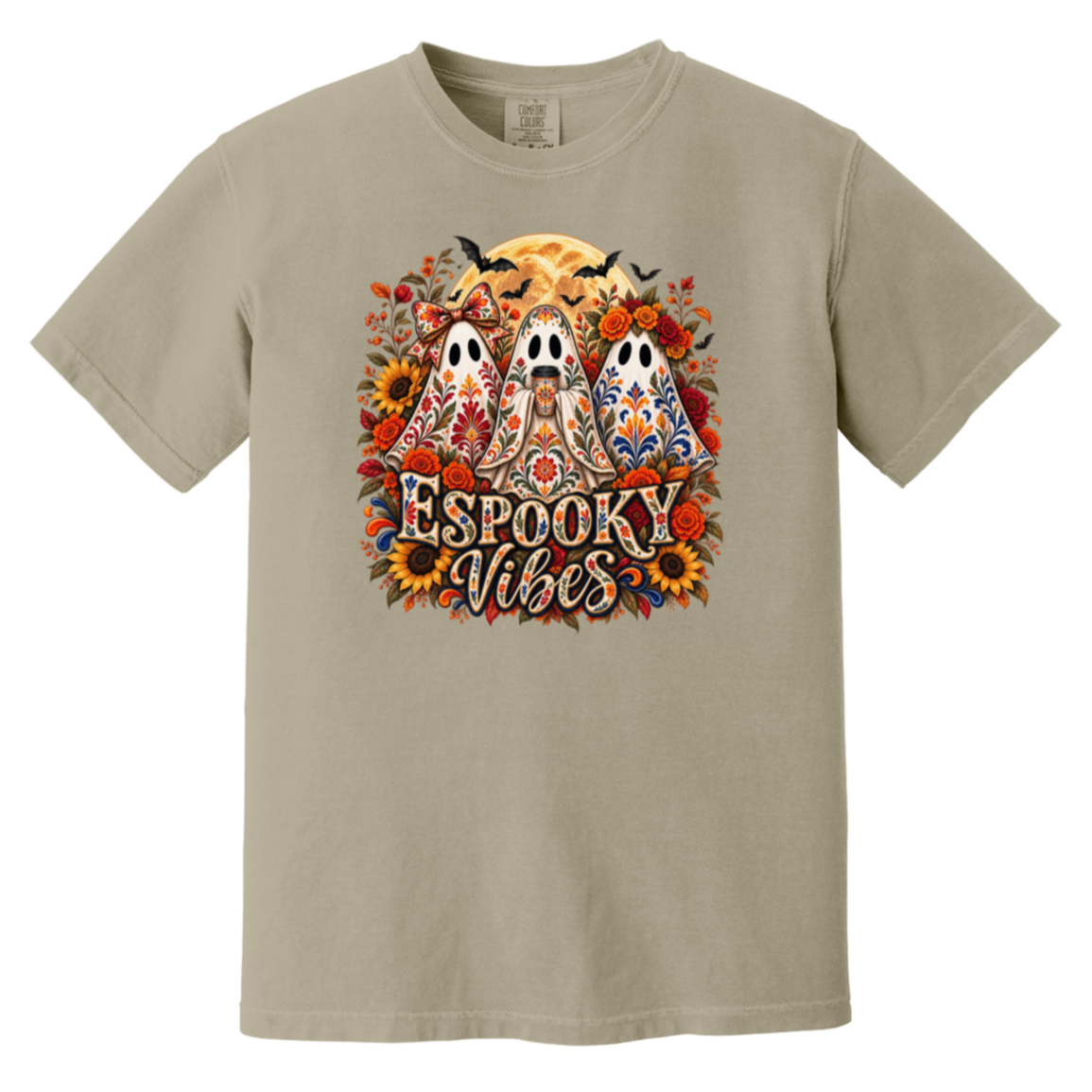 Beige crewneck t-shirt featuring a colorful graphic print of three decorated ghosts, sunflowers, bats, and the text 'Espooky Vibes' in a stylized font.