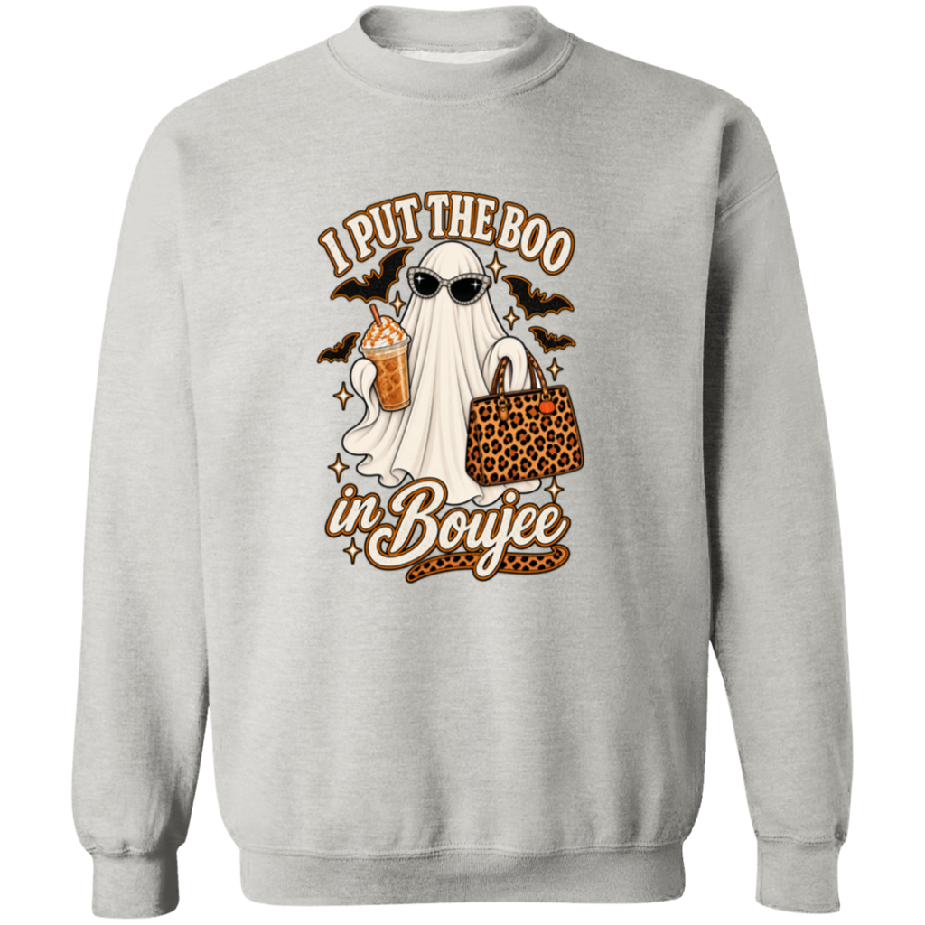 A light gray crewneck sweatshirt featuring a Halloween-themed graphic print. The design shows a ghost wearing sunglasses and holding a leopard-print handbag next to a drink, with the text 'I PUT THE BOO in Boujee' in brown and white stylized lettering.