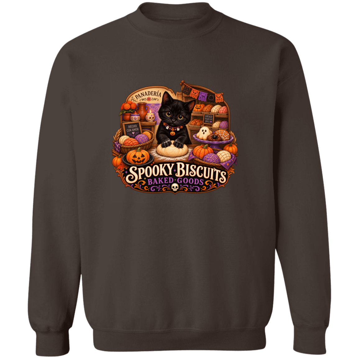 Brown crewneck sweatshirt with a large, colorful Halloween-themed graphic on the front. The graphic features a black cat surrounded by pumpkins, ghosts, and the text 'Spooky Biscuits Baked Goods'.