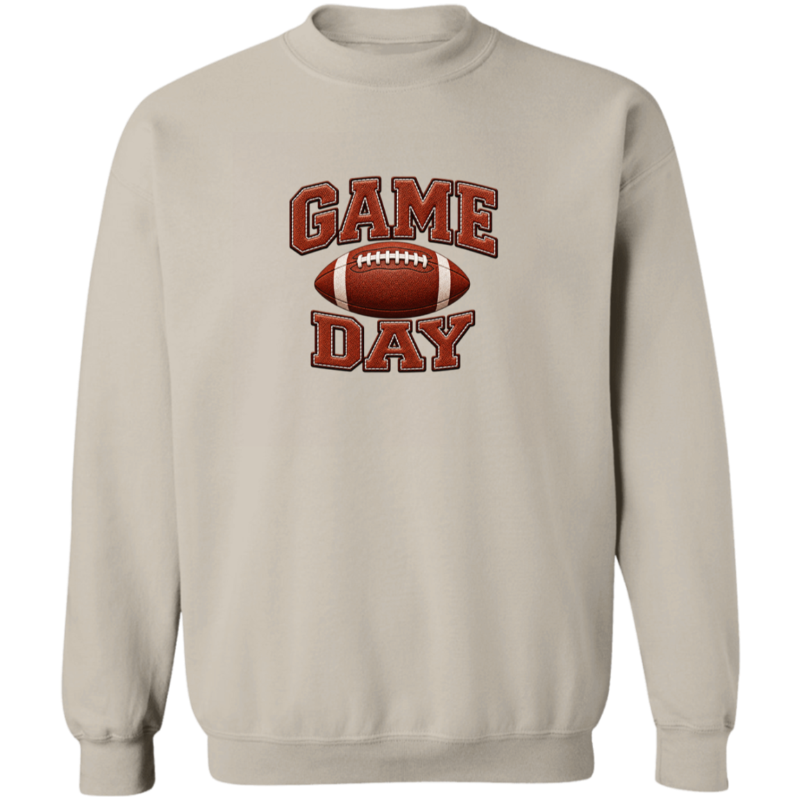 A light beige crewneck sweatshirt featuring a 'GAME DAY' football graphic on the chest, displayed against a solid white background.