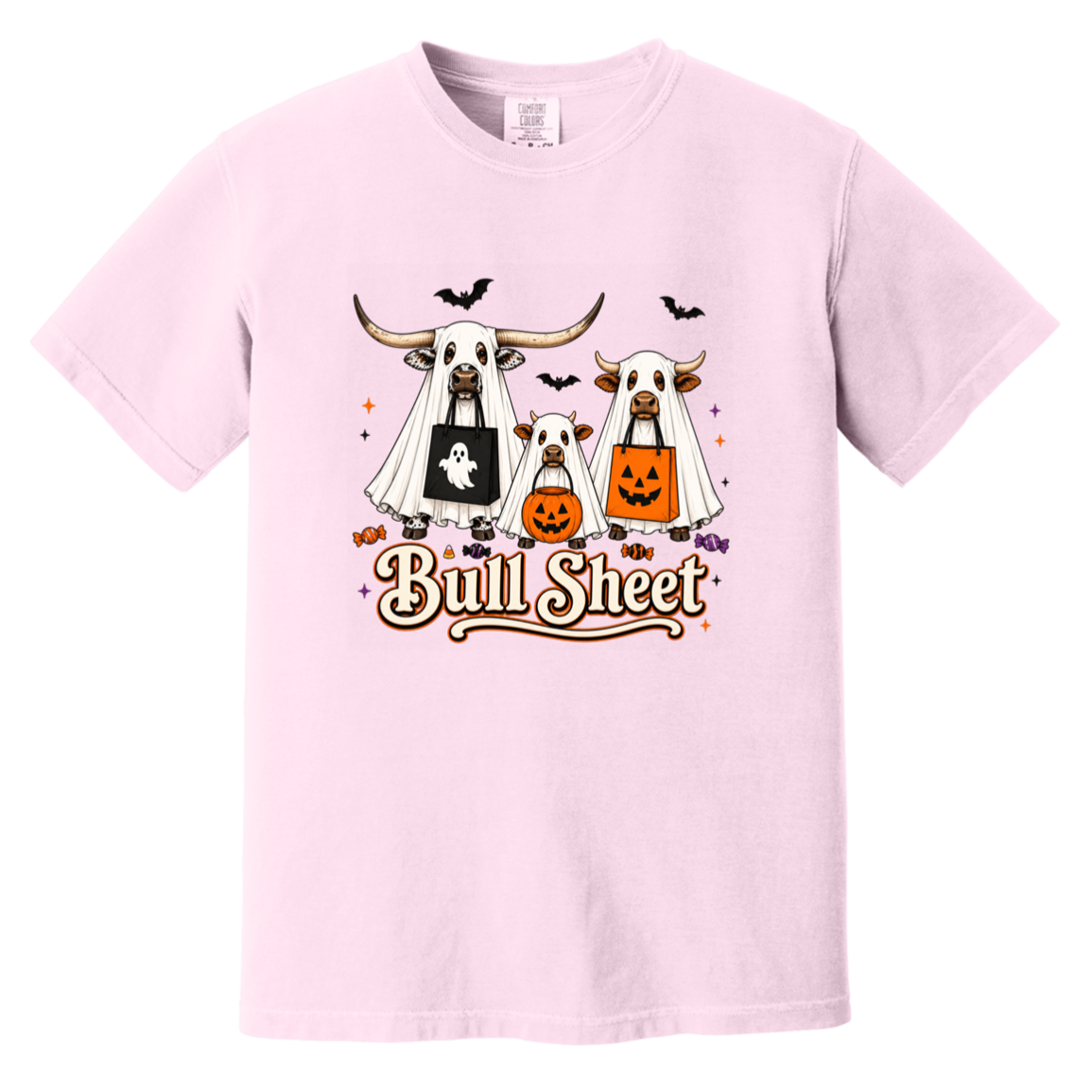 A light pink crewneck t-shirt featuring a Halloween graphic of three longhorn bulls dressed in ghost costumes, with one pumpkin and one ghost bag, and the text 'Bull Sheet' written below.