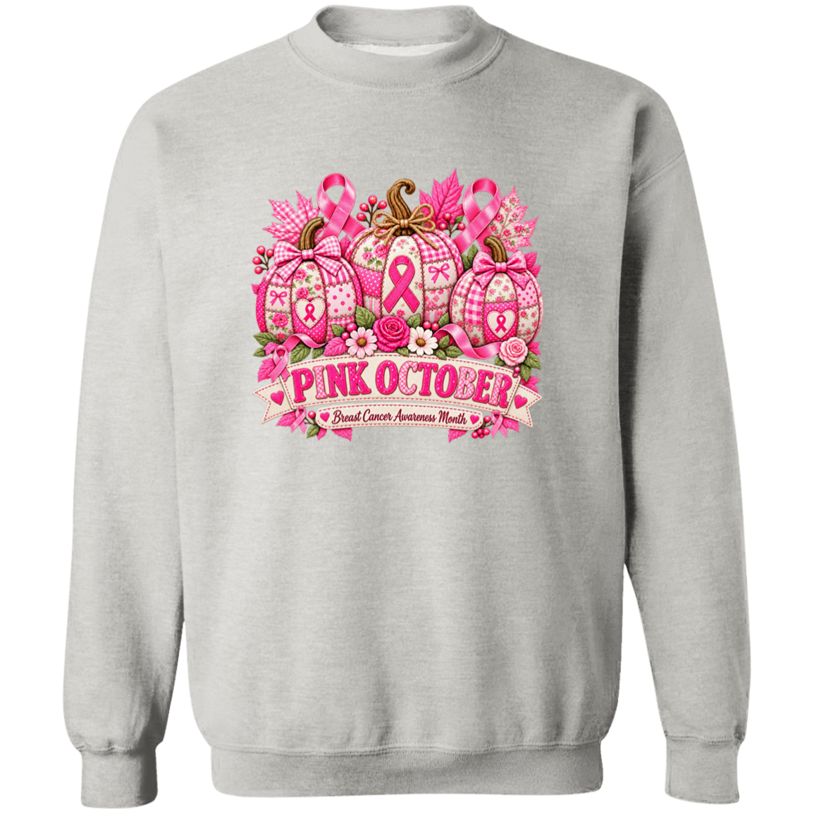 A light gray crewneck sweatshirt featuring a 'Pink October' breast cancer awareness graphic on the chest. The graphic depicts three patterned pumpkins decorated with pink ribbons, bows, and flowers, with a banner below reading 'PINK OCTOBER' and 'Breast Cancer Awareness Month'.