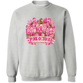 A light gray crewneck sweatshirt featuring a large 'Pink October' breast cancer awareness graphic on the chest, displayed against a solid white background.
