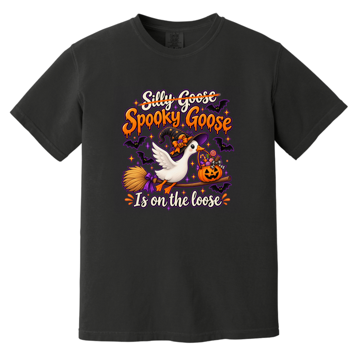 A black short-sleeve crewneck t-shirt featuring a colorful Halloween graphic with the text 'Silly Goose Spooky Goose Is on the loose' in orange and white, accompanied by a white goose, a witch's broom, a jack-o'-lantern, and bats.