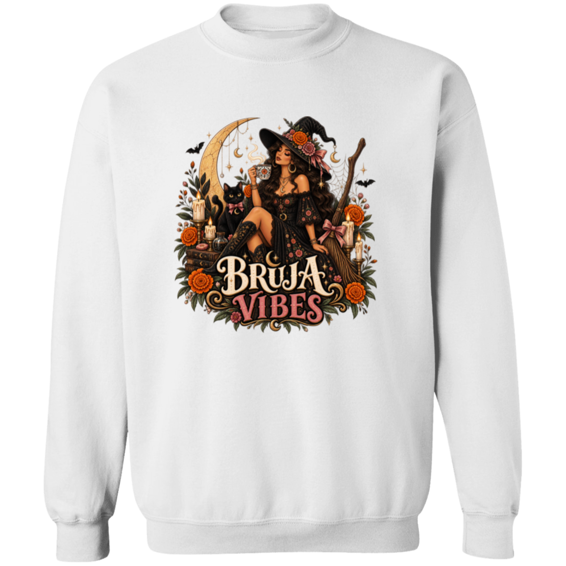 white crewneck sweatshirt with a large graphic print on the front. The graphic features a witch in a black hat sitting on a broomstick next to a black cat, surrounded by orange flowers and the text 'BRUJA VIBES'.
