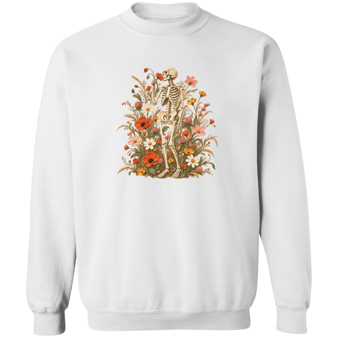 A white crewneck sweatshirt featuring a vintage-style graphic of a skeleton standing amidst a dense field of colorful wildflowers, including red, orange, yellow, and white blossoms.