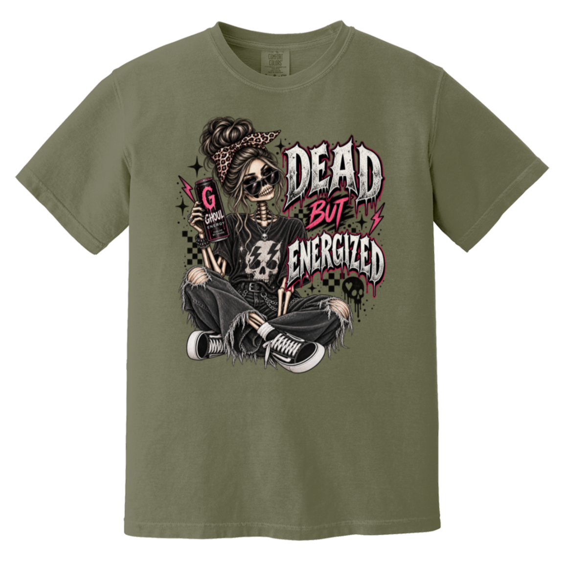 A beige crewneck t-shirt featuring a gothic-style graphic of a skeleton woman with sunglasses, a bandana, and ripped jeans, sitting cross-legged with the text 'DEAD BUT ENERGIZED' in a distressed font.