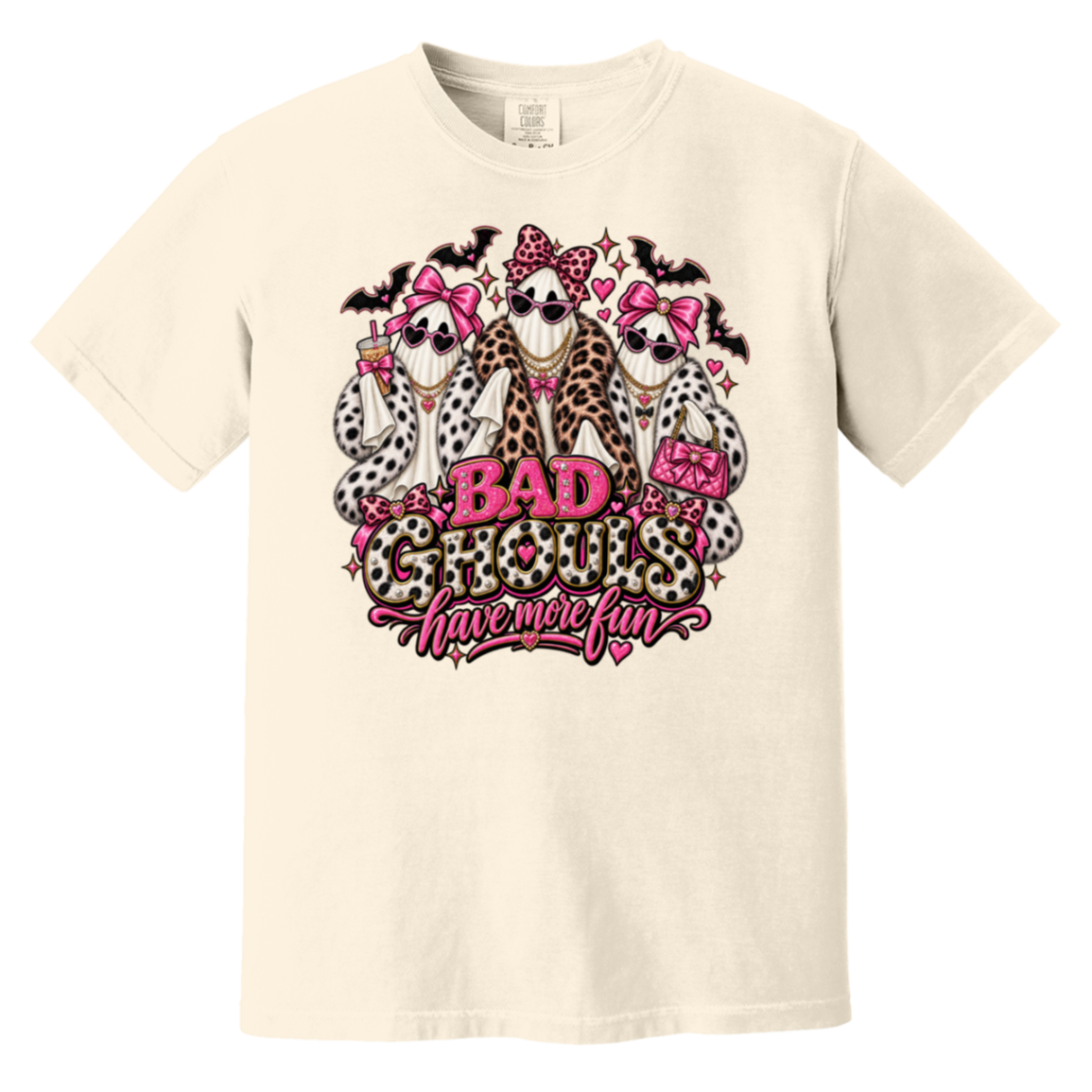 cream t-shirt with a graphic print of three ghosts dressed in faux fur outfits and pink bows, with the text 'BAD GHOULS have more fun' in pink and leopard print.