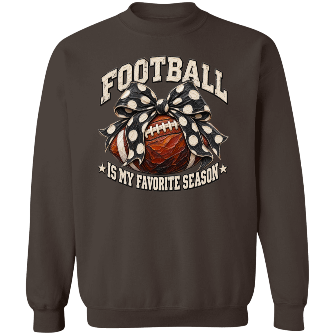 A dark brown crewneck sweatshirt featuring a graphic print of a football wrapped in a black and white polka dot bow, with the text 'FOOTBALL IS MY FAVORITE SEASON' in a distressed cream font.
