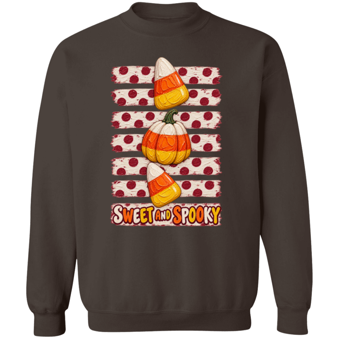 dark brown sweatshirt with a Halloween design with two candy corns, one pumpkin, red polka dots on a distressed cream background, and the words 'SWEET AND SPOOKY' at the bottom.