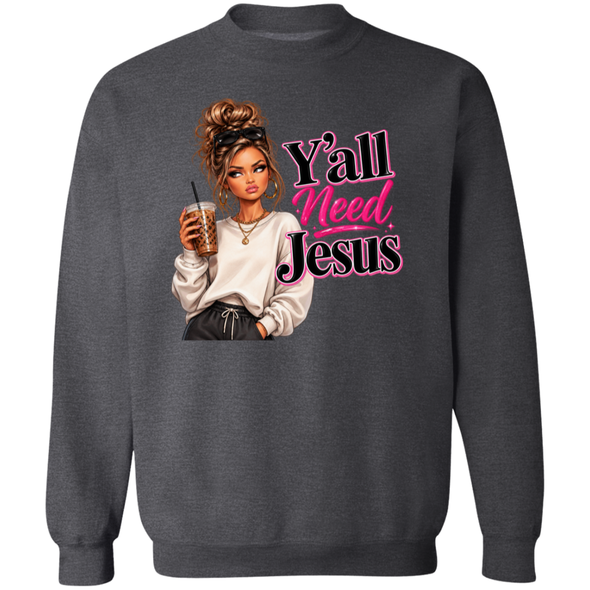 A dark gray crewneck sweatshirt featuring a graphic print of a woman holding an iced coffee next to the text 'Y'all Need Jesus' in pink and black stylized lettering.