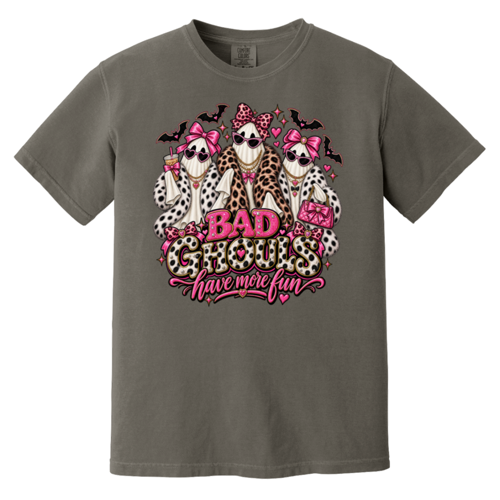 dark gray t-shirt with a graphic print of three ghosts dressed in faux fur outfits and pink bows, with the text 'BAD GHOULS have more fun' in pink and leopard print.