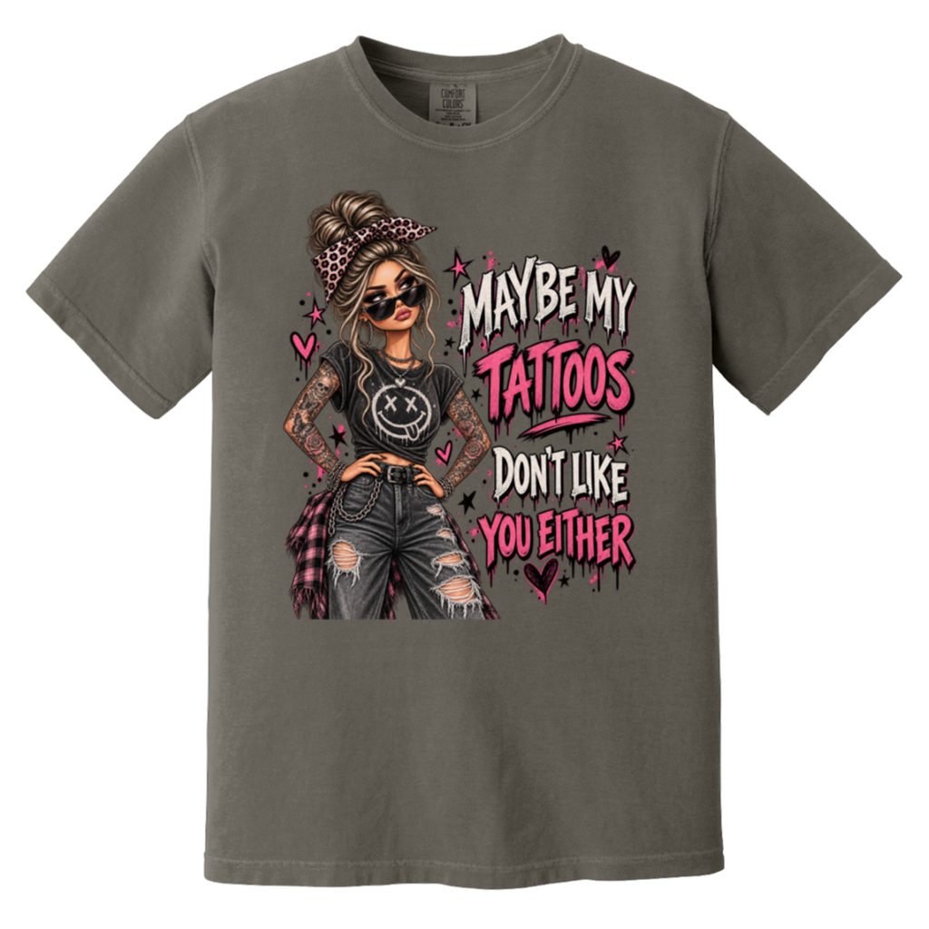 a dark gray tshirt with a graphic of a woman with two sleeves of tattoos on her arms and a text that says "maybe my tattoos don't like you either" 