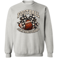 A light gray crewneck sweatshirt featuring a graphic design on the front with the text 'FOOTBALL IS MY FAVORITE SEASON'. The graphic depicts a brown football wrapped in a black and white polka dot bow, set against a clean white background.