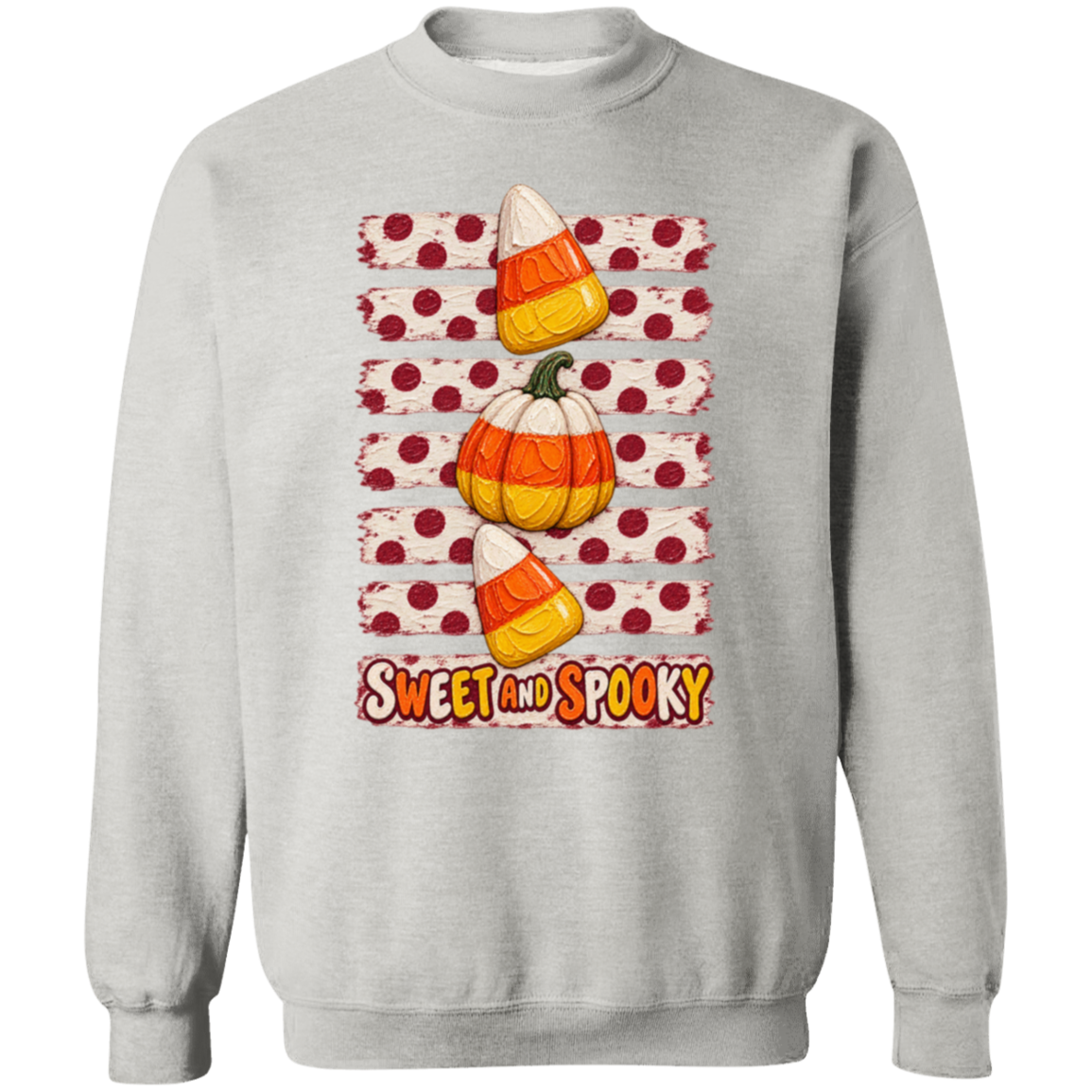 a gray sweatshirt with Halloween design with two candy corns, one pumpkin, red polka dots on a distressed cream background, and the words 'SWEET AND SPOOKY' at the bottom.