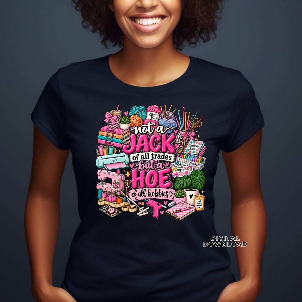A woman wearing a graphic t-shirt with a colorful sewing and quilting-themed design and the text 'not a JACK of all trades but a HOE of all hobbies'.