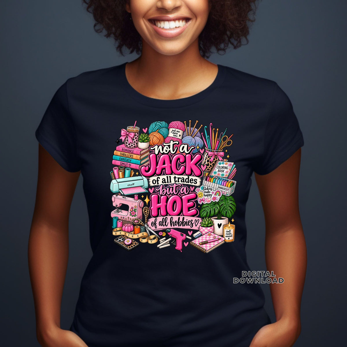 A woman wearing a graphic t-shirt with a colorful sewing and quilting-themed design and the text 'not a JACK of all trades but a HOE of all hobbies'.