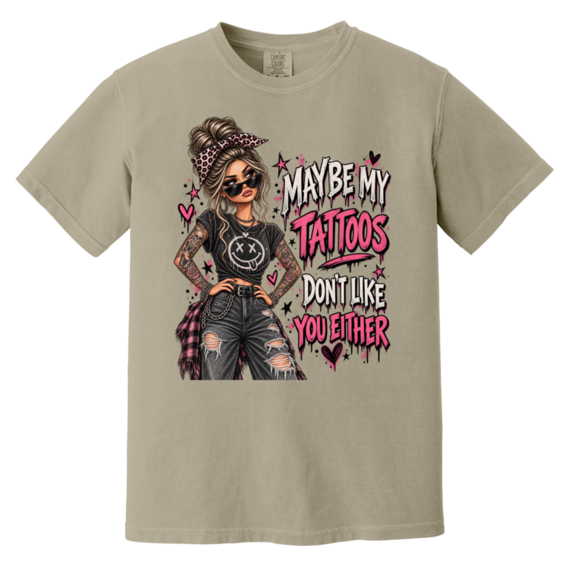 tan tshirt with a graphic of a woman with two sleeves of tattoos on her arms and a text that says "maybe my tattoos don't like you either" 