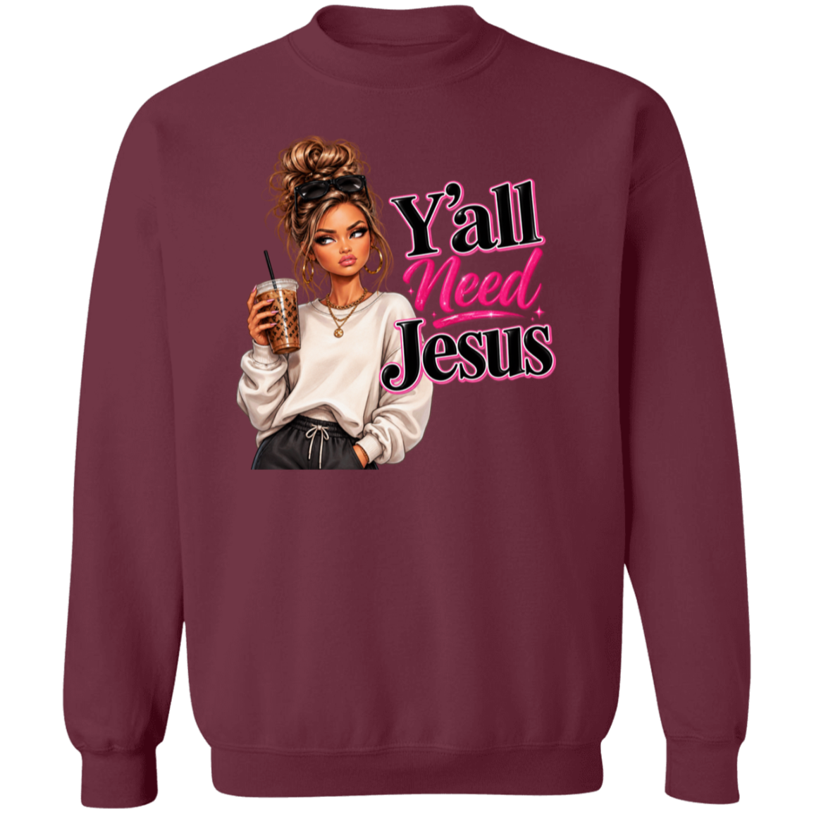 A maroon crewneck sweatshirt featuring a graphic print of a woman holding an iced coffee next to the text 'Y'all Need Jesus' in pink and black lettering.