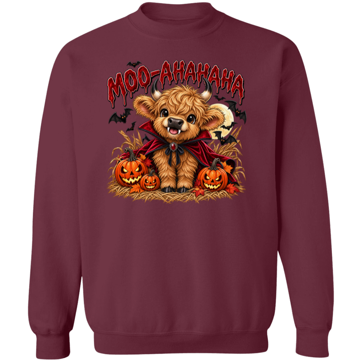 maroon crewneck sweatshirt featuring a cartoon graphic of a fluffy brown Scottish highland cow dressed in a red cape, surrounded by jack-o'-lanterns, with the text 'MOO-AAHAHAHA' in red above it.