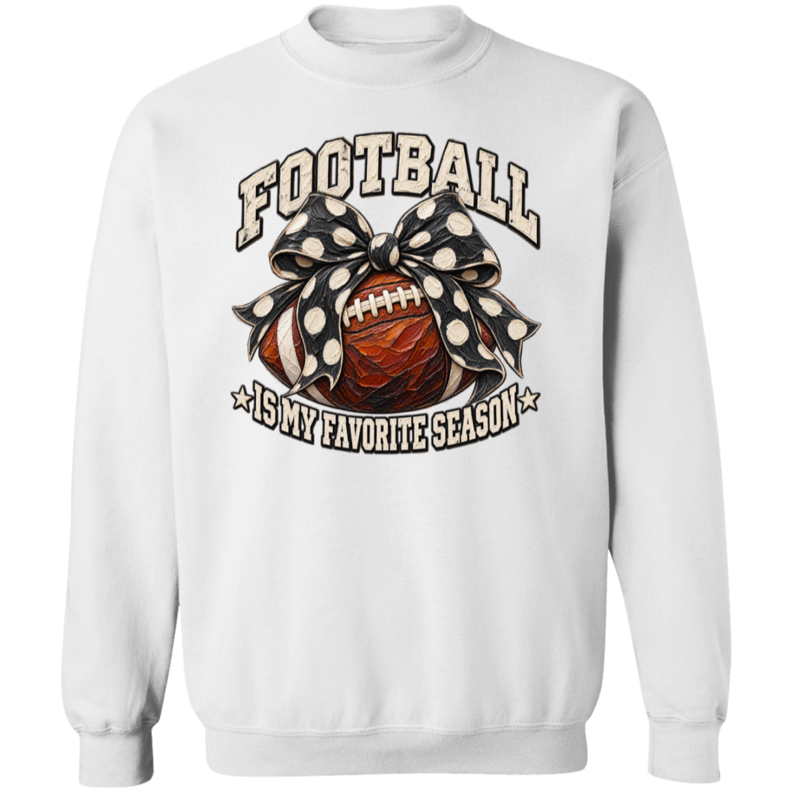 A white crewneck sweatshirt featuring a graphic print of a football wrapped in a black and white polka dot bow, with the text 'FOOTBALL IS MY FAVORITE SEASON' in a distressed font.